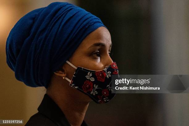 Rep. Ilhan Omar speaks to reporters in Statuary Hall on Capitol Hill as the House of Representatives convene to impeach President Donald Trump,...