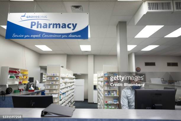 Pharmacists speaks on the phone at Graves Drug pharmacy in Arkansas City, Kansas, U.S., on Friday, March 5, 2021. Independent pharmacy owners in the...