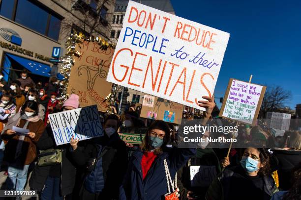 People attend a demonstration during the International Women's Day in Berlin, Germany on March 8, 2021. A few thousands of people, in particular...