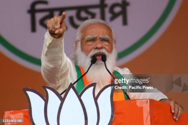India's Prime Minster Narendra Modi addresses supporters of the Bharatiya Janata Party during a mass rally ahead of the state legislative assembly...
