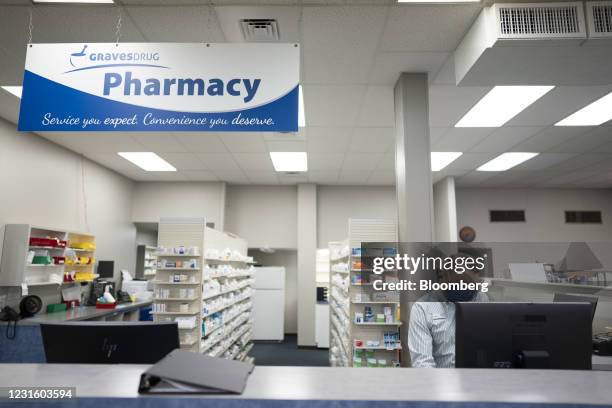 Pharmacists speaks on the phone at Graves Drug pharmacy in Arkansas City, Kansas, U.S., on Friday, March 5, 2021. Independent pharmacy owners in the...