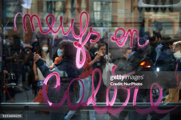 Graffitti on a glass reads 'Angry women'. Thousands of women and men took to the streets of Toulouse for the International Women's Day. This year,...