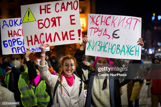 Women holding signs during a rally for gender equality and womens rights on the streets of Sofia to condemn violence against women in Sofia, Bulgaria...