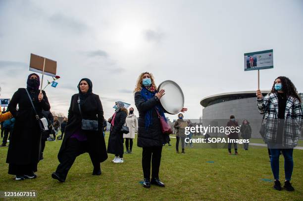 Group of women are seen singing Arabic songs during the march. The event was organized by "8 maartcomité", an independent initiative group of active...