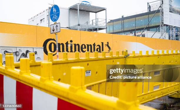 March 2021, Lower Saxony, Hanover: Fences with the company logo stand at the construction site of Continental AG's new corporate headquarters. The...
