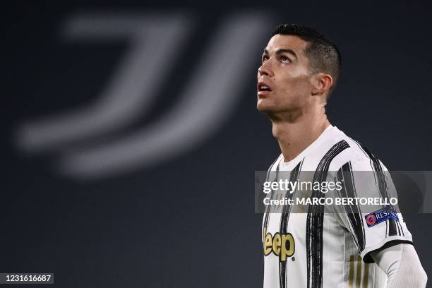 Juventus' Portuguese forward Cristiano Ronaldo reacts during the UEFA Champions League round of 16 second leg football match between Juventus Turin...