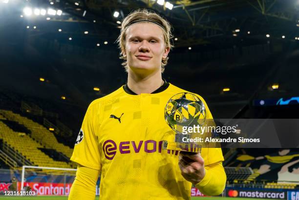 Erling Haaland of Borussia Dortmund celebrates the win and his Man Of The Match trophy after the final whistle during the Champions League match...