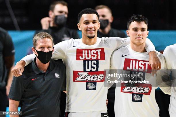 Gonzaga head coach Mark Few and Gonzaga guard Jalen Suggs look on during the national anthem before the semifinal game of the men's West Coast...
