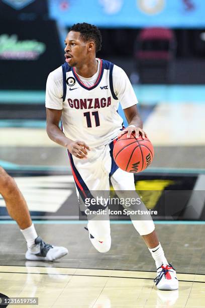 Gonzaga forward Joel Ayayi drives to the basket during the semifinal game of the men's West Coast Conference basketball tournament between the St....