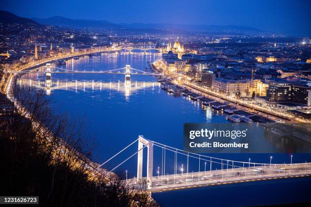 Lights illuminate the city skyline and the Chain Bridge at night in Budapest, Hungary, on Tuesday, March 9, 2021. Prime Minister Viktor...