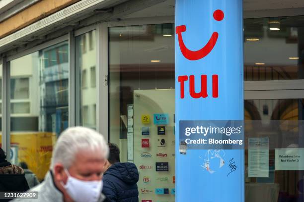 Pedestrians pass a closed TUI AG travel center in Mainz, Germany, on Wednesday, March 10, 2021. Voters go to the polls on for state elections in...