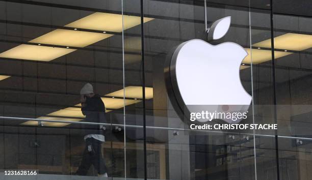 The logo of US tech giant Apple can be seen on an Apple store in Munich, southern Germany. - Apple said it planned to invest more than one billion...