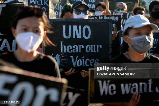 Members of the Tibetan Student Association take part in a protest on the occasion of the 62nd Anniversary of the Tibetan National Uprising Day...