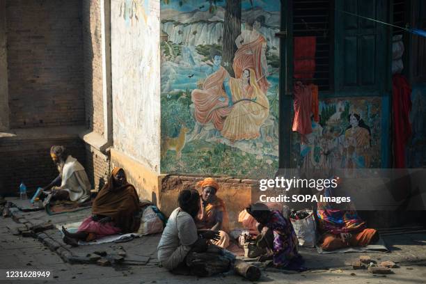 Hindu devotees, or sadhu, are seen sitting at the Pashupatinath Temple premises ahead of the Shivaratri festival in Kathmandu. Hindu Devotees from...