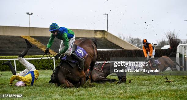 Wexford , Ireland - 10 March 2021; Jockey Mark Walsh, centre, falls from Stand Off, next to jockey Alan King, left, who fell from Take All and jockey...