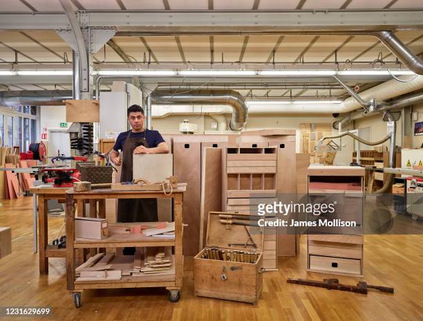 Carpenter and leather craftsman Darwin Quezada Escobar is photographed for the Wall Street Journal on March 29, 2017 in AsniËres-sur-Seine, France.