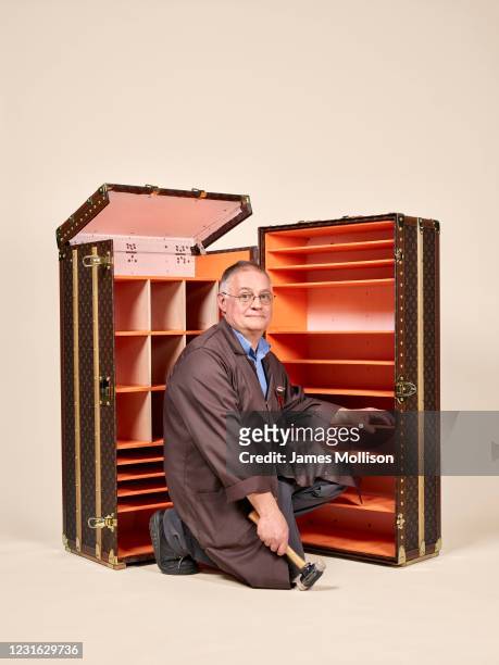 Technical trunk maker Michel Dufrenoy with a special-order trunk is photographed for the Wall Street Journal on March 29, 2017 in AsniËres-sur-Seine,...