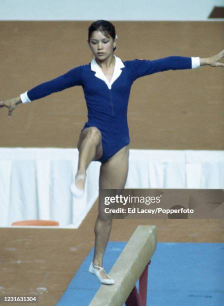 Nelli Kim competing for the Soviet Union in the Women's balance beam gymnastics event at the 1976 Summer Olympics inside the Montreal Forum in...