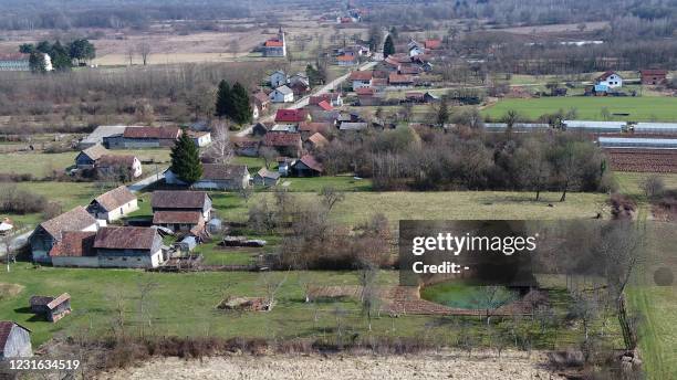 An aerial picture taken on March 10, 2021 shows a sinkhole in the village of Mecencani. - The region about 40 kilometers southwest of the capital,...