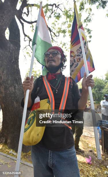 Tibetan Writer and activist Tenzin Tsundue participate in a protest to commemorate the anniversary of the 1959 Tibetan uprising against Chinese rule...