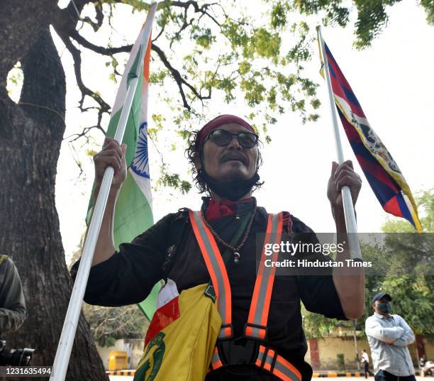 Tibetan Writer and activist Tenzin Tsundue participate in a protest to commemorate the anniversary of the 1959 Tibetan uprising against Chinese rule...