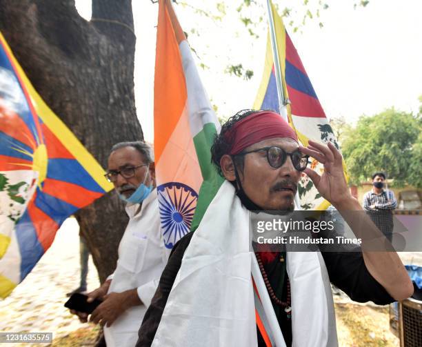 Tibetan Writer and activist Tenzin Tsundue participate in a protest to commemorate the anniversary of the 1959 Tibetan uprising against Chinese rule...