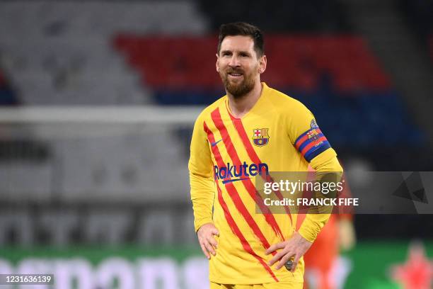Barcelona's Argentinian forward Lionel Messi reacts during the UEFA Champions League round of 16 second leg football match between Paris...