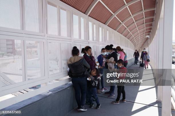 Group of migrants rapidly deported from the US under Title 42 wait on the Mexican side of the Paso del Norte International Bridge, between El Paso,...