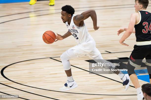 Penn State Nittany Lions guard Izaiah Brockington starts a fast break during the men's Big Ten tournament college basketball game between the...