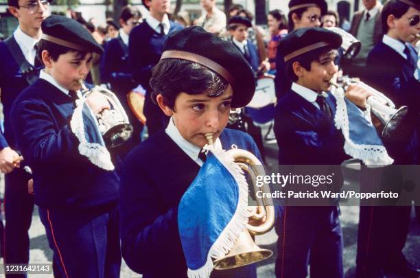 Uniformed boy buglers in a procession during Holy Week or Semana Santa de Sevilla in Seville, Spain, circa April 1987.