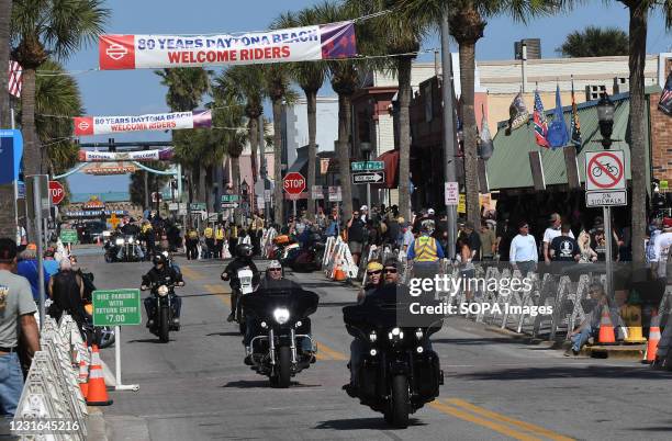 Motorcyclists ride down Main Street during the 80th year of Daytona Beach's annual Bike Week event. Few people were seen wearing face masks or...