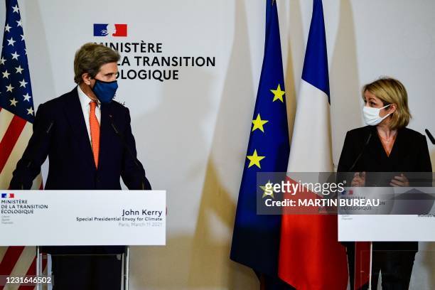 French Ecological Transition Minister Barbara Pompili and US climate envoy John Kerry speak during a press conference following their meeting at the...