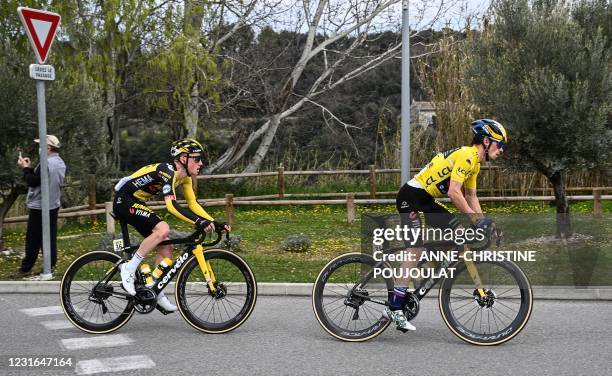 Team Jumbo rider Slovenia's Primoz Roglic wearing the overall leader's yellow jersey and Team Jumbo rider Netherlands' Sam Oomen compete during the...