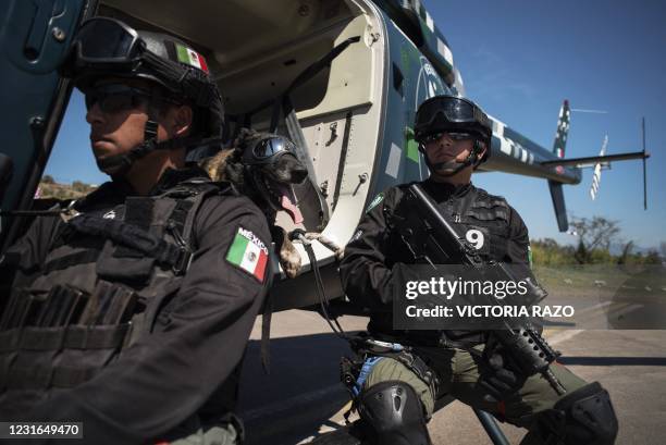 The trainer of the company K-9 of the Civil Force of Veracruz, Daniel Ortega, , takes part in an exhibition accompanied by the canine agent "Sheriff"...