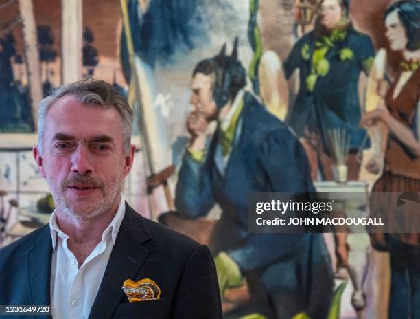 German painter Neo Rauch poses in front of his painting "Der Stammbaum", during a press preview of his exhibition "Der Beifang" at the Gutshaus...