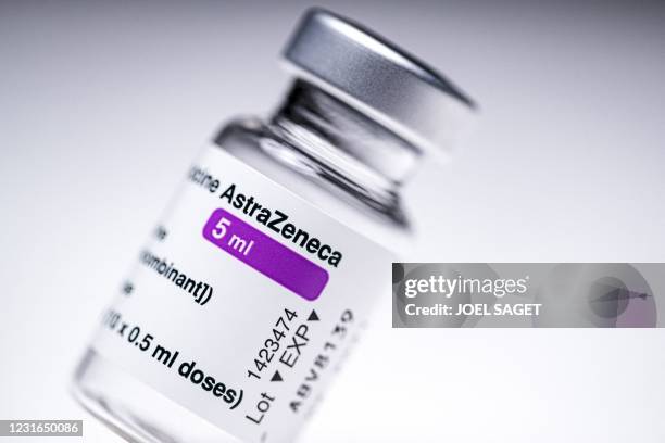 This picture shows a vial of the AstraZeneca Covid-19 vaccine in Paris on March 11, 2021. - European countries can keep using AstraZeneca's...