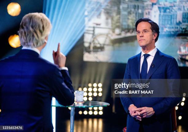 Leader Geert Wilders and VVD's Mark Rutte debate during Pauw's election debates on March 11 in Amsterdam. - Presenter Jeroen Pauw leads a series of...