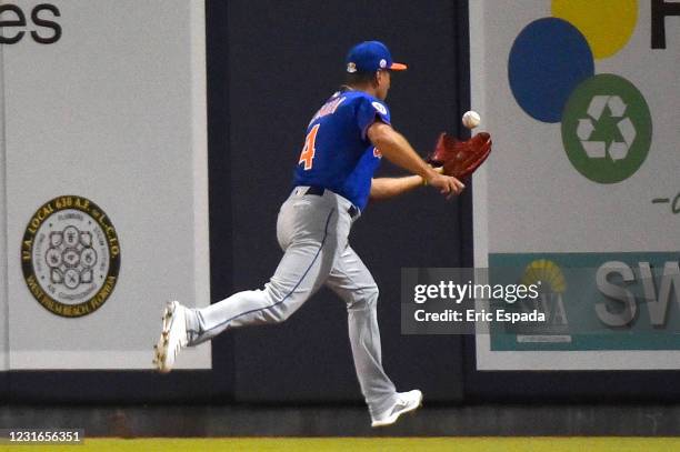 Albert Almora Jr. #4 of the New York Mets makes a running catch during the fifth inning of the spring training game against the Houston Astros at The...