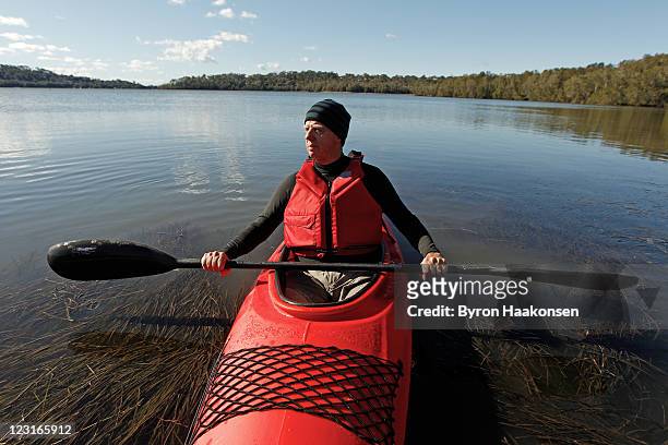 senior man in kayak on lake - life jacket stock pictures, royalty-free photos & images