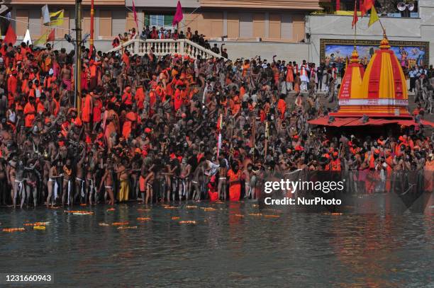 Naga Sadhus or holy men of Juna Akhara take holy dip in Ganges River on the occasion of first royal bath of Shivratri festival during Maha Kumbh...