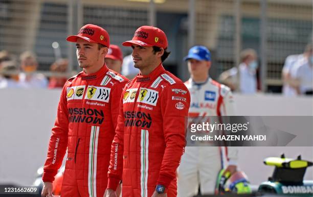 Ferrari's Monegasque driver Charles Leclerc and Ferrari's Spanish driver Carlos Sainz Jr look on during first day of the Formula One pre-season...