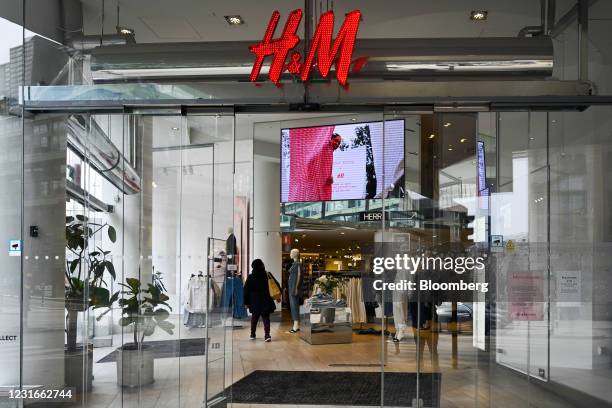 Customers browse products inside a Hennes & Mauritz AB store in Stockholm, Sweden, on Thursday, March 11, 2021. Hennes & Mauritz are due to report...