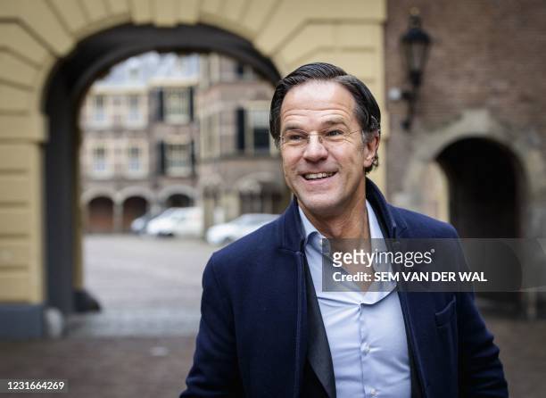 Dutch outgoing Prime Minister Mark Rutte arrives at the Binnenhof in The Hague for the weekly Council of Ministers on March 12, 2021. - Netherlands...