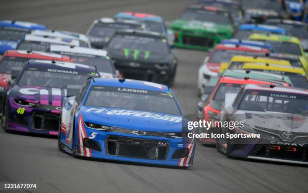 Kyle Larson , driver of the Hendrick Motorsports HendrickCars.com Chevrolet Camaro, leads Denny Hamlin , driver of the Joe Gibbs Racing FedEx Ground...