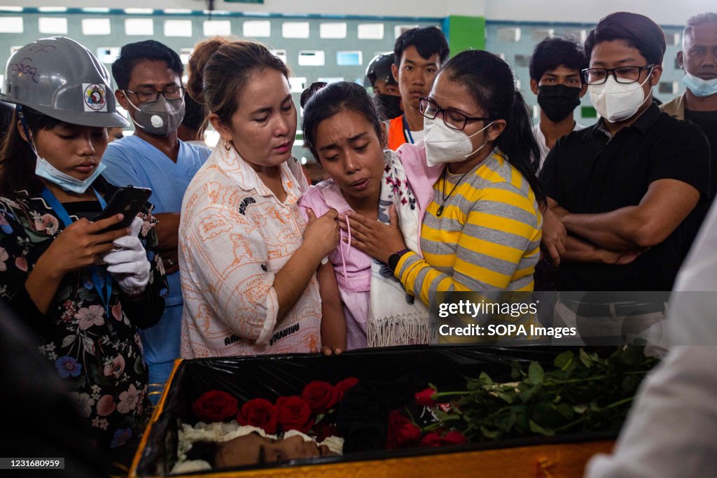 (EDITORS NOTE: Image depicts death) Relative react at the...