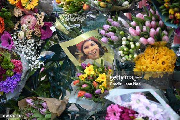 Photograph of Sarah Everard is left with tributes to her at the bandstand on Clapham Common on March 13, 2021 in London, United Kingdom. Vigils are...