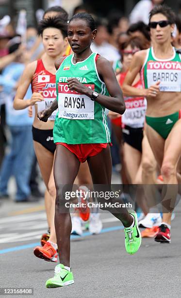 Atsese Baysa of Ethiopia competes in the women's marathon during day one of 13th IAAF World Athletics Championships at the Daegu Stadium on August...