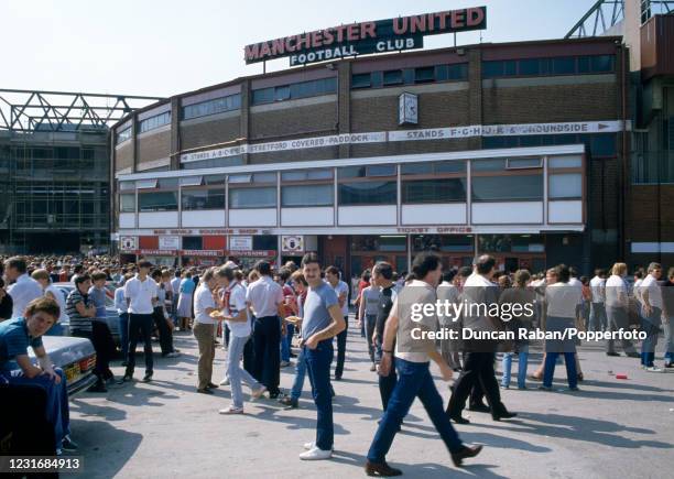 Fans gather outside the souvenir shop and ticket office before the Canon League Division One match between Manchester United and Watford at Old...