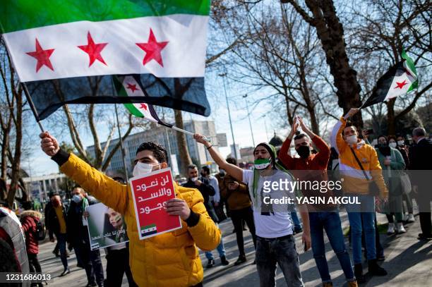 People rally as they mark the 10th anniversary of the start of the war in Syria, on March 13, 2021 in Istanbul. - More than 3.6 million Syrians...