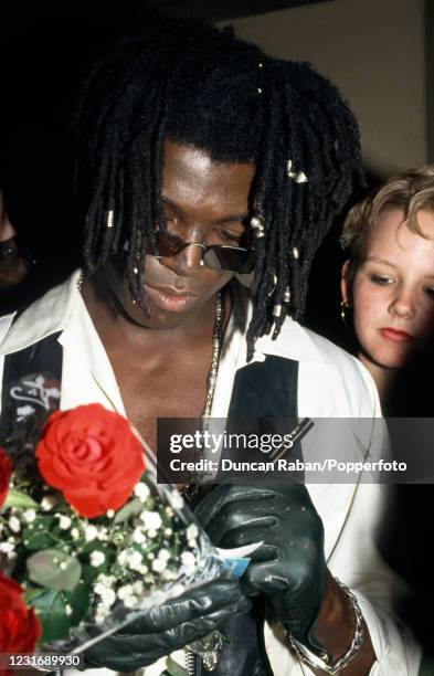 British singer Seal signing autographs, circa 1992.